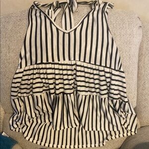 Striped Black and White Women's Top fits big. Multiple ways to tie